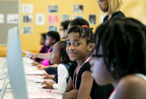 black girls at computers learning to code
