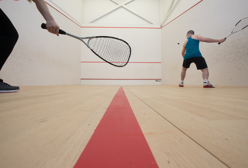 Two people play squash on the courts at Institute of Sport and Exercise