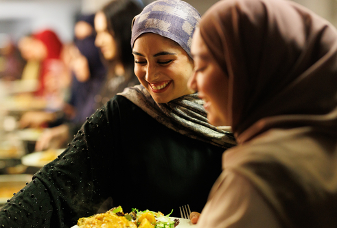 Image of two students enjoying the iftar meal