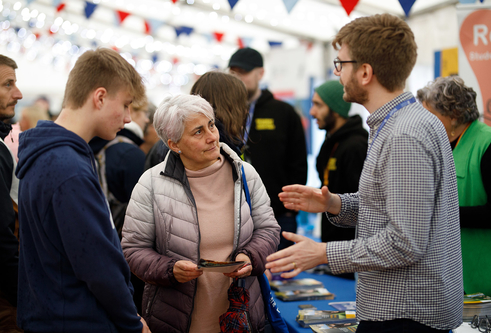 Attendees at open day speaking to staff