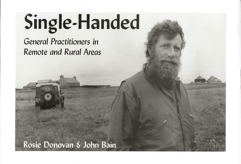 Book cover of the book ‘Single Handed’, a black and white image of a man standing in a field with a land rover behind him.