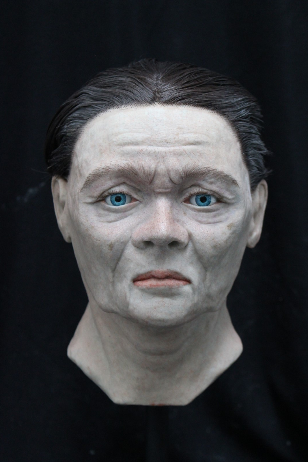An archaeological facial reconstruction of a man by the name of John Hand, sculpted out of modelling wax and painted with oil paint.